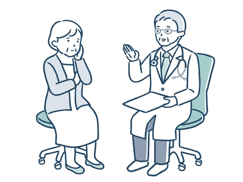 医師が患者に説明をしている